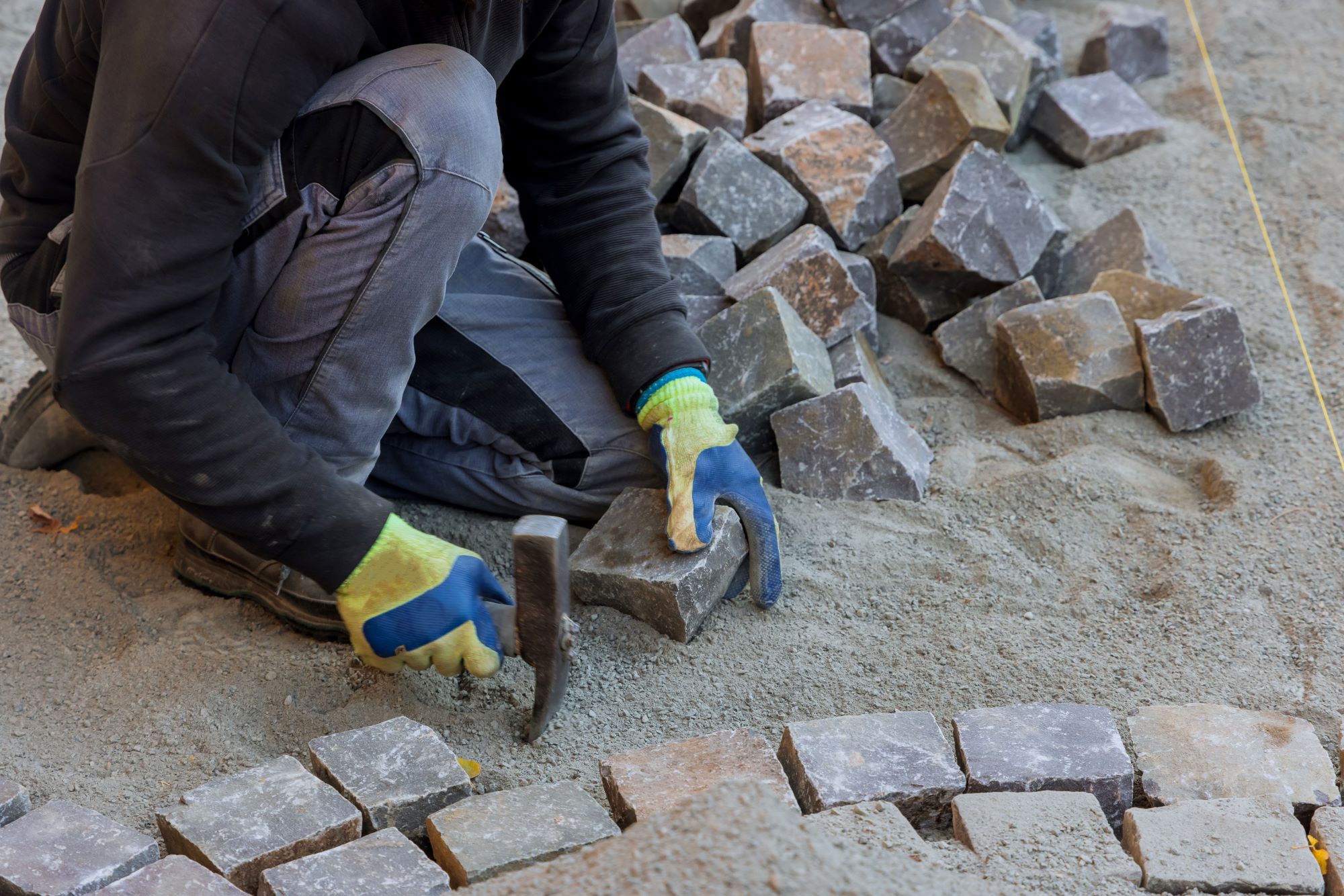 man laying stonework