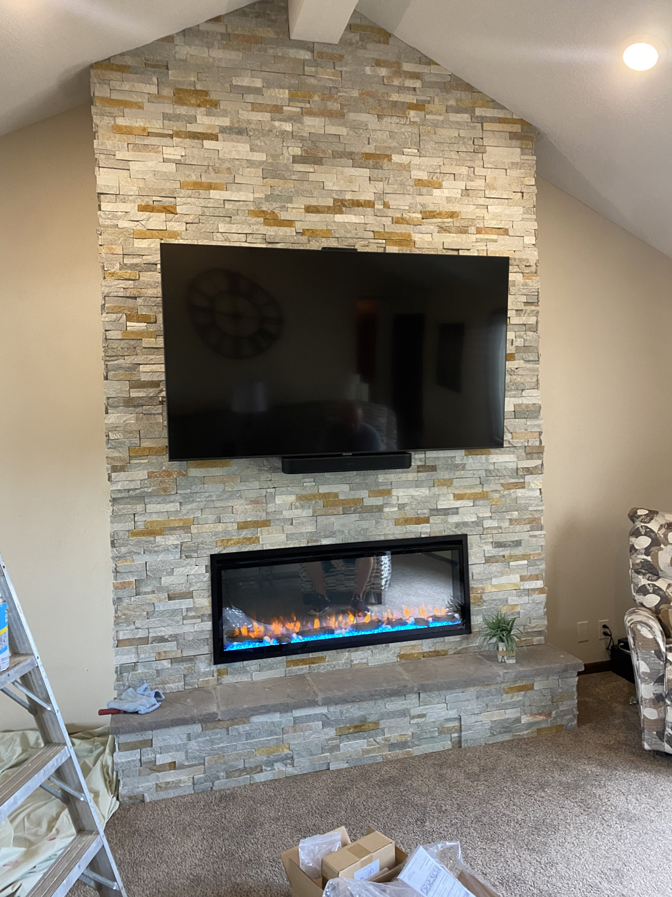 Linear electric fireplace with blue ember lighting
